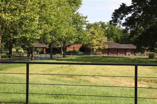 NFL Farms - The gate/entrance to the house on-site. I could not take pictures closer of the house or interiors as it is currently not available for filming. Could be ready at a later date for the right project potentially. (7/2/2015 - Credits: Yousef Kazemi)
