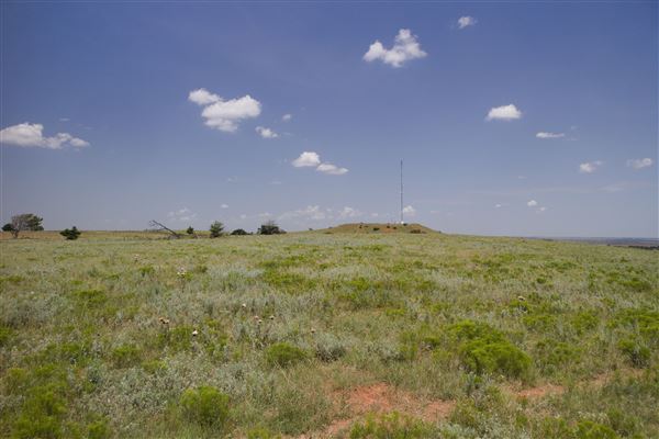 Rydell Ranch - field 2 - 2 mounds with 100' deep "red rock" canyons in between  visibility of up to 30 miles from the top of the mound Covered in mostly in eastern red cedar and some oak trees with native grasses. features slot canyons and waterfalls.  (7/28/2021 - Credits: Jeffrey Rydell)