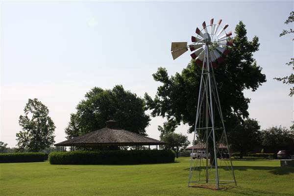 NFL Farms - The gazebo and windmill in the circle drive which houses the office and a couple barns - main vein from where roads branch off into property. (7/2/2015 - Credits: Yousef Kazemi)