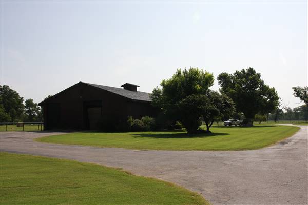 NFL Farms - Barn near the gazebo and windmill in the circle drive which houses the office and a couple barns - main vein from where roads branch off into property. (7/2/2015 - Credits: Yousef Kazemi)
