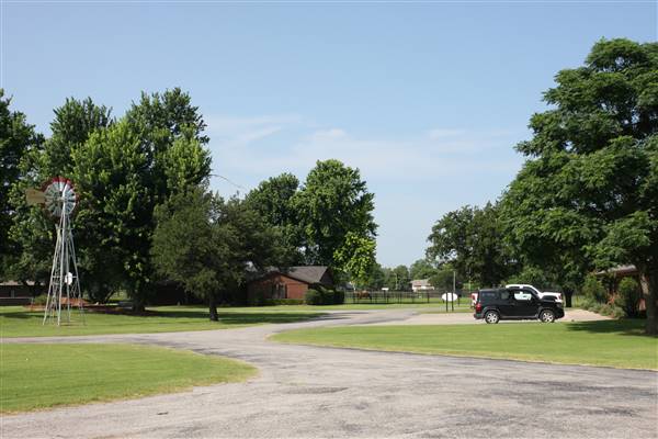 NFL Farms - The windmill and office in the circle drive which houses the office and a couple barns - main vein from where roads branch off into property. (7/2/2015 - Credits: Yousef Kazemi)
