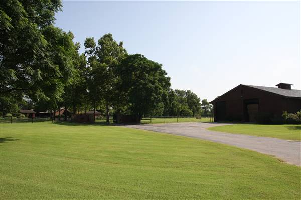 NFL Farms - Barn and main house near the gazebo and windmill in the circle drive which houses the office and a couple barns - main vein from where roads branch off into property. (7/2/2015 - Credits: Yousef Kazemi)