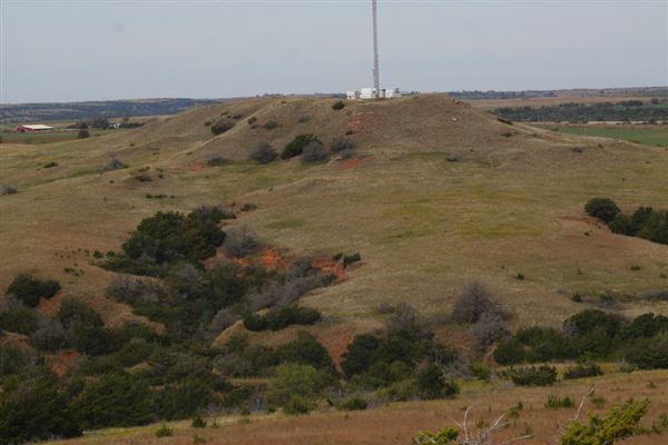 Rydell Ranch - field 2 - 2 mounds with 100' deep "red rock" canyons in between  visibility of up to 30 miles from the top of the mound Covered in mostly in eastern red cedar and some oak trees with native grasses. features slot canyons and waterfalls.  (7/28/2021 - Credits: Jeffrey Rydell)